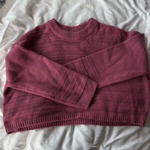 Cropped pink cable knit sweater